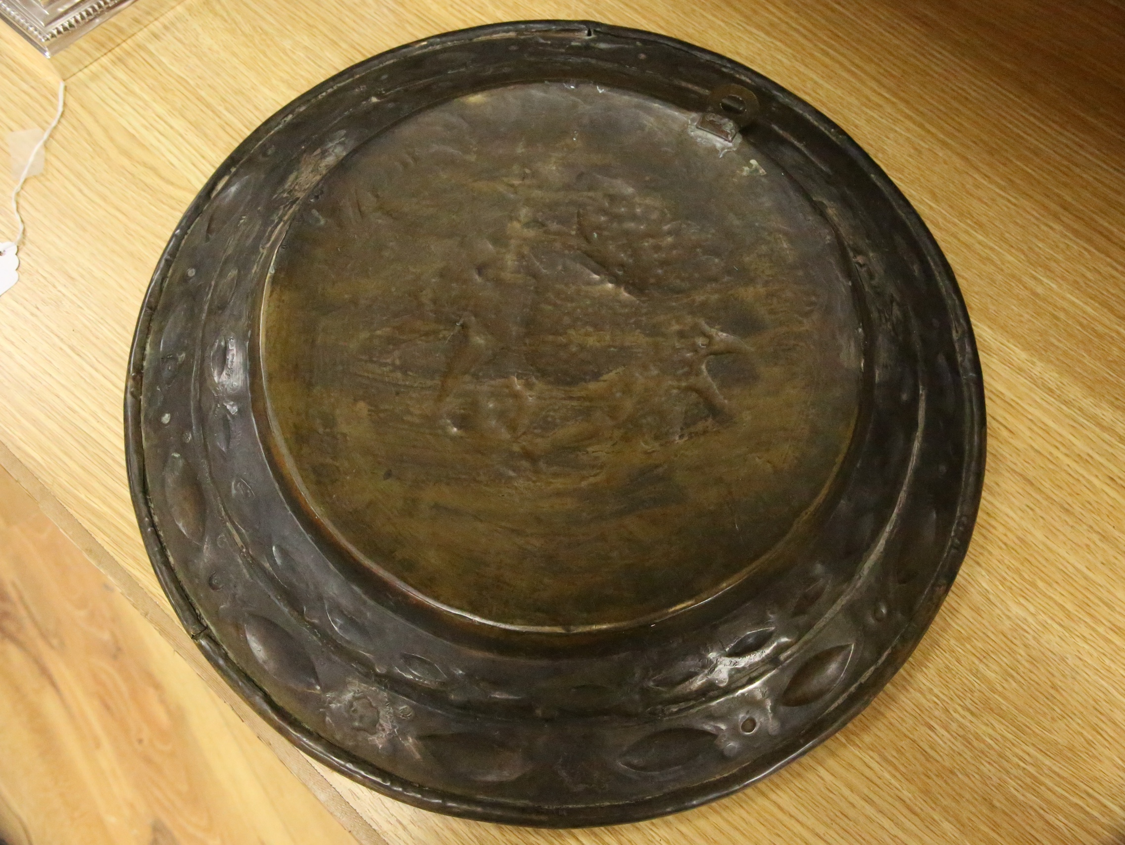 A 17th century Nuremberg brass alms dish, 43cm diameter. Condition - good for age